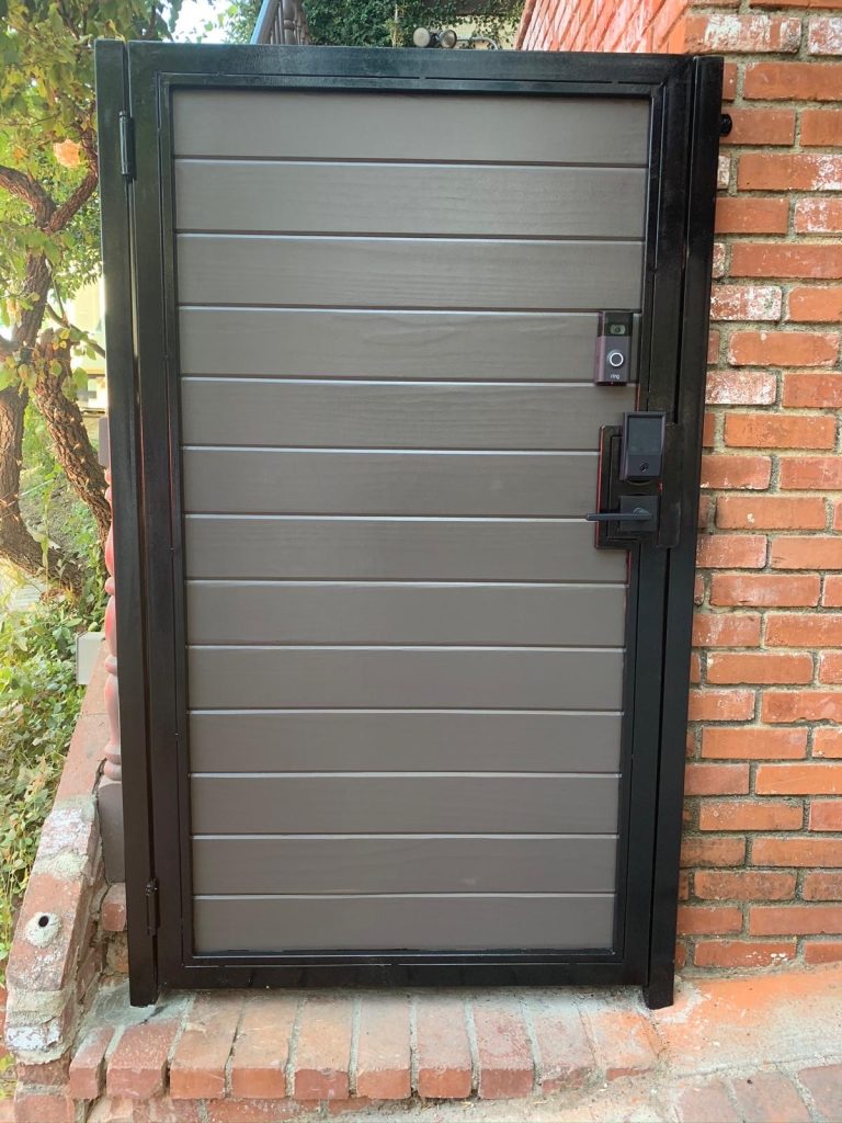 Composite pedestrian gate with matching panel