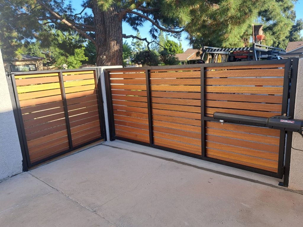 Metal driveway gate with horizontal wood infill