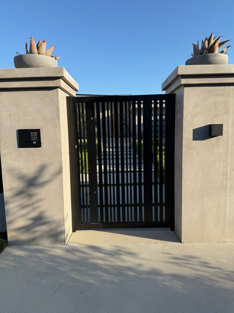 Modern vertical slat pedestrian gate